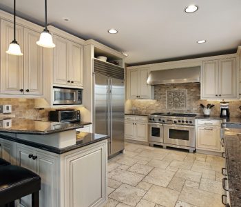 Upscale kitchen in luxury home with breakfast bar